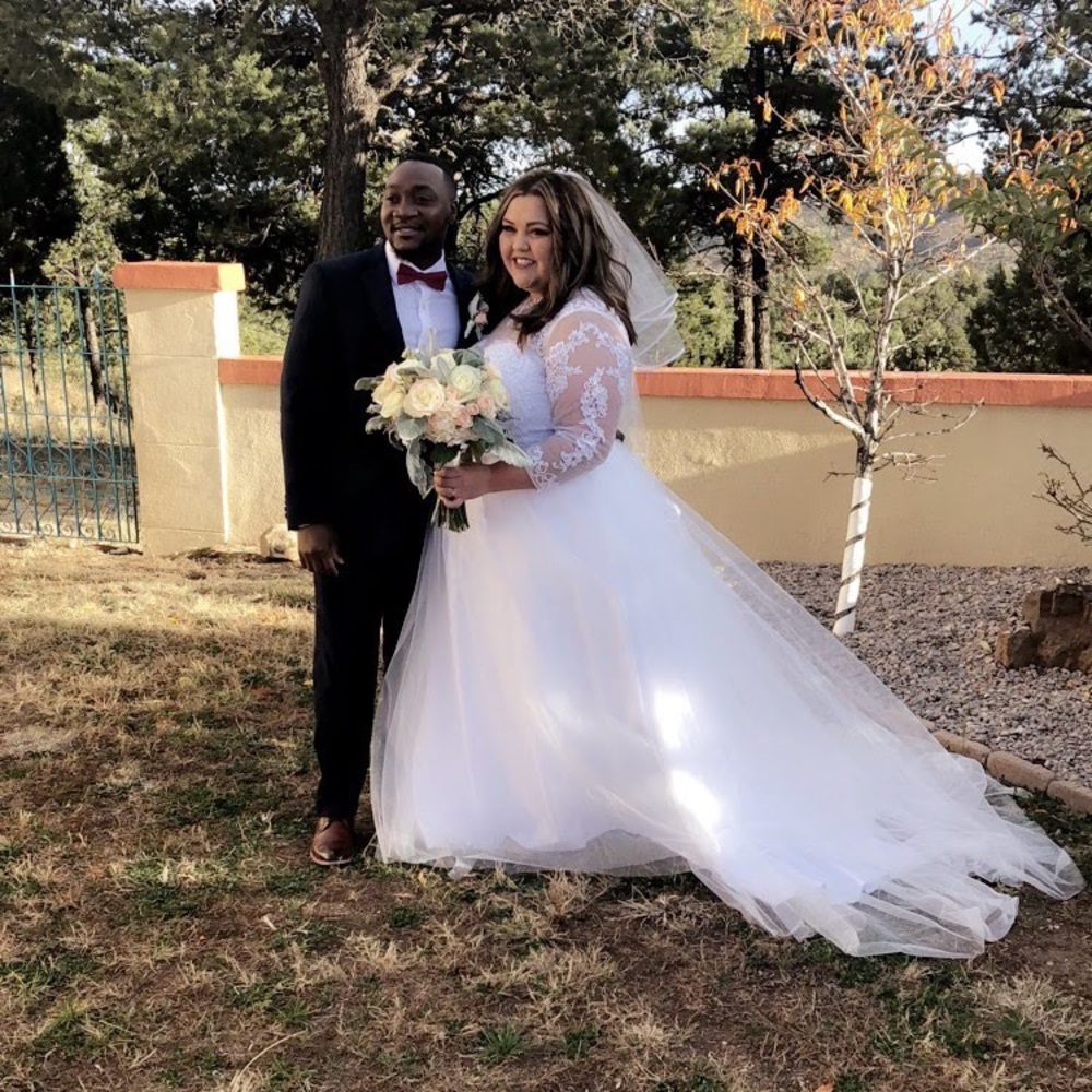 Wedding dress. Size 20. Can fit 22. Flattering.